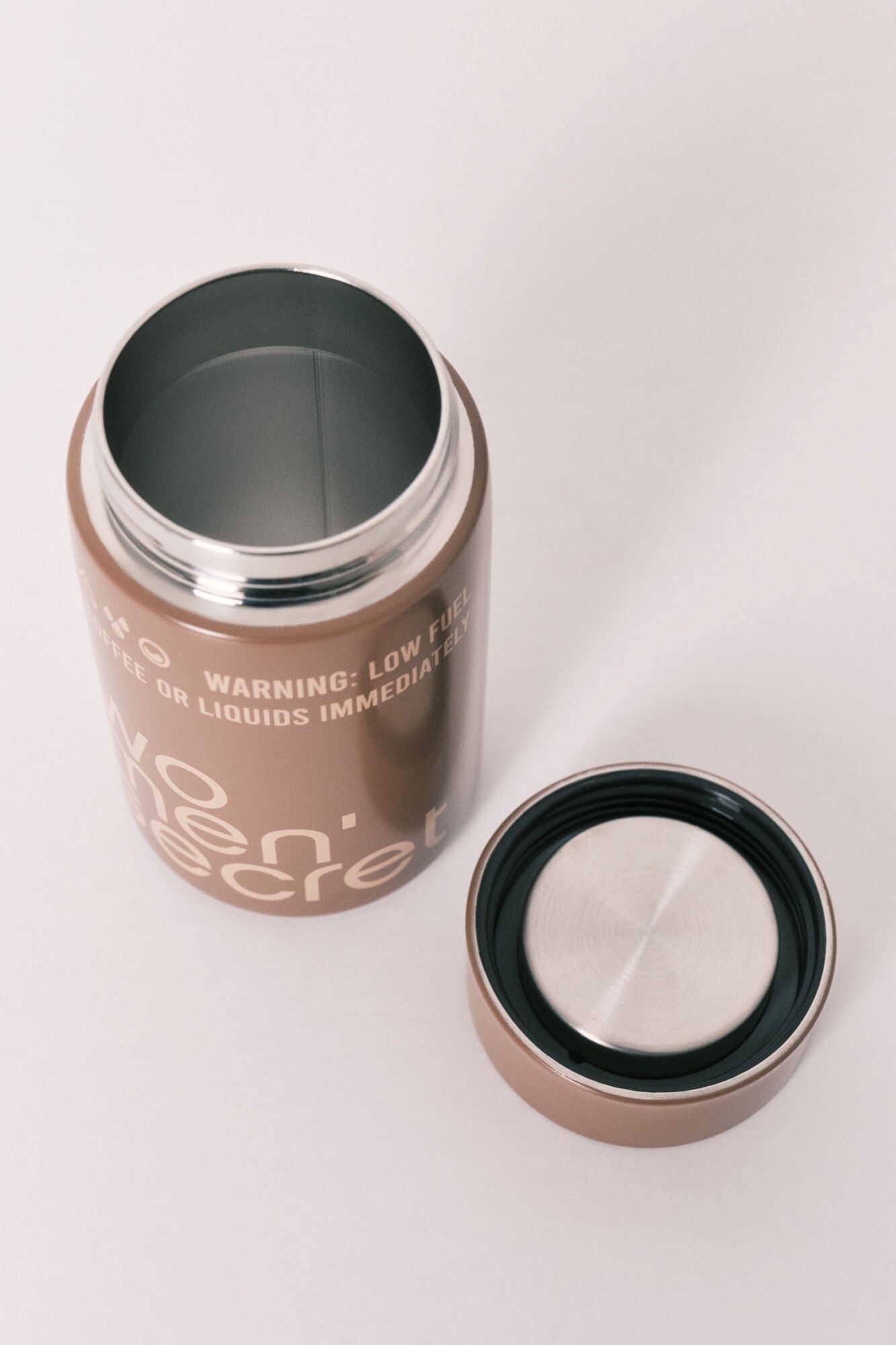 Brown metal logo bottle