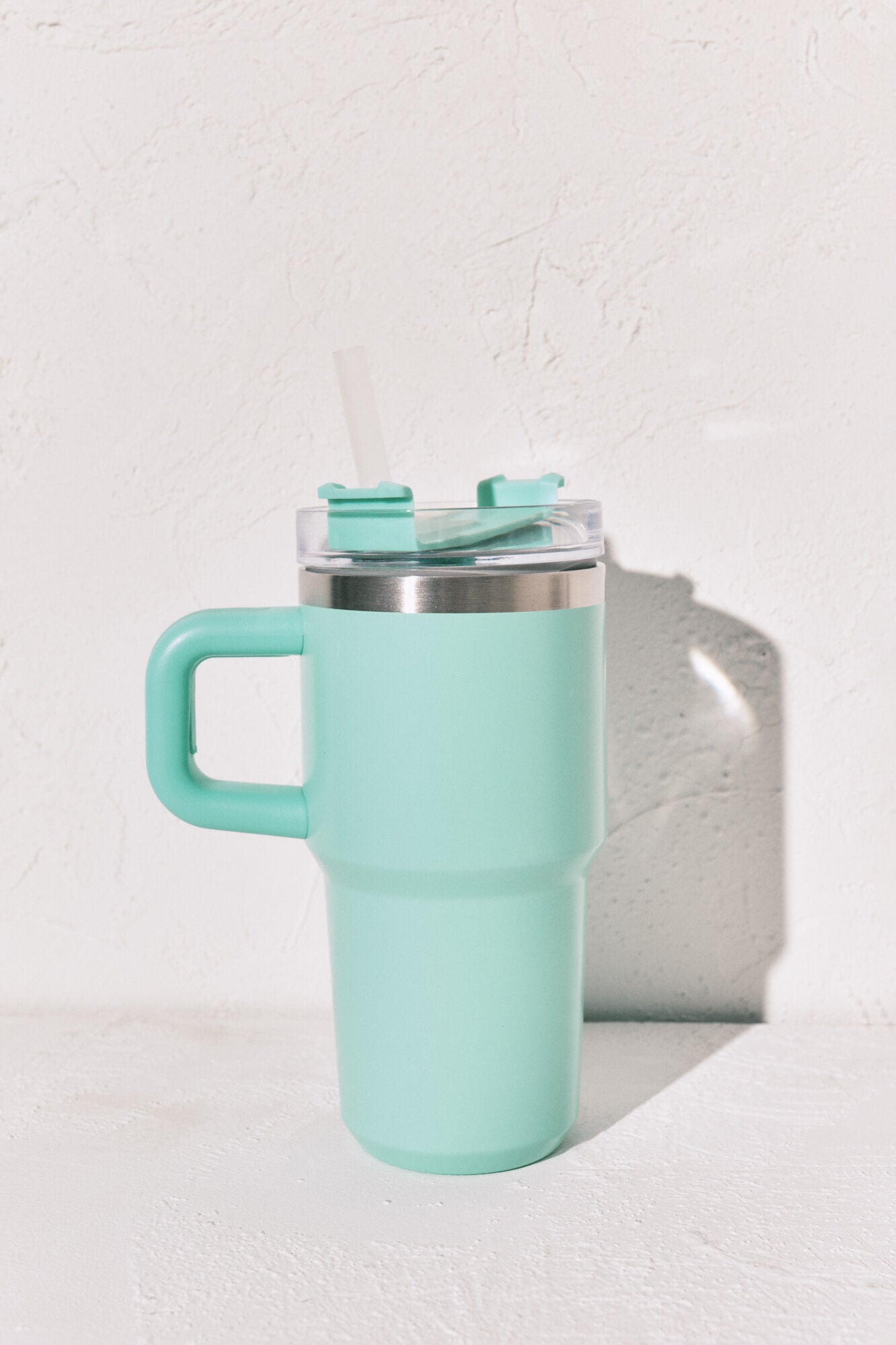 Stainless steel bottle with blue handle