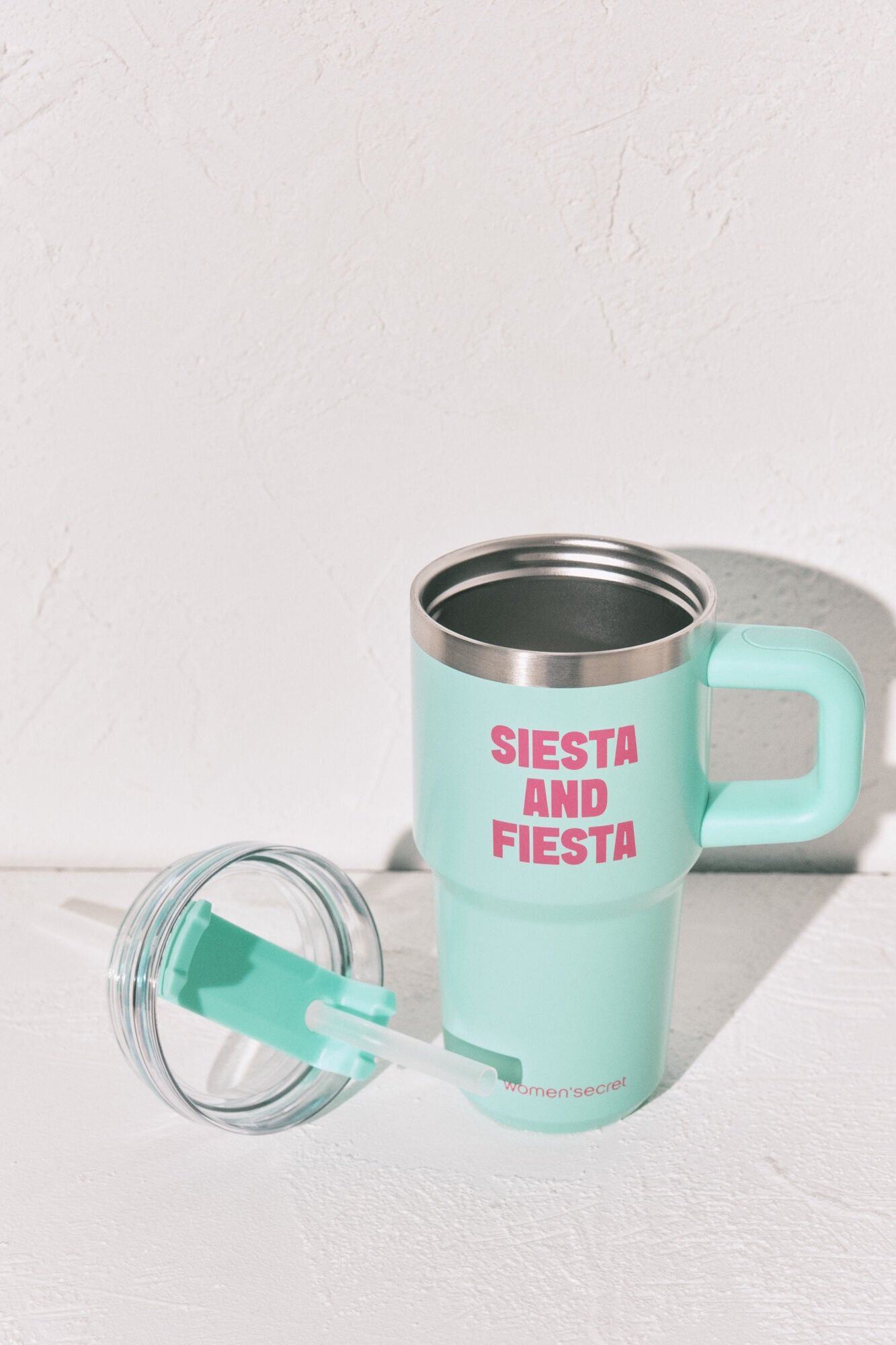 Stainless steel bottle with blue handle
