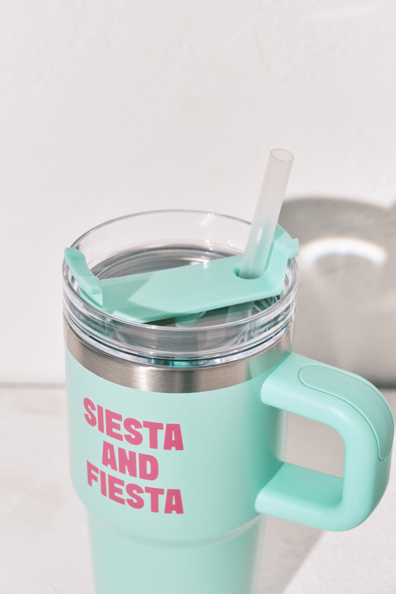 Stainless steel bottle with blue handle