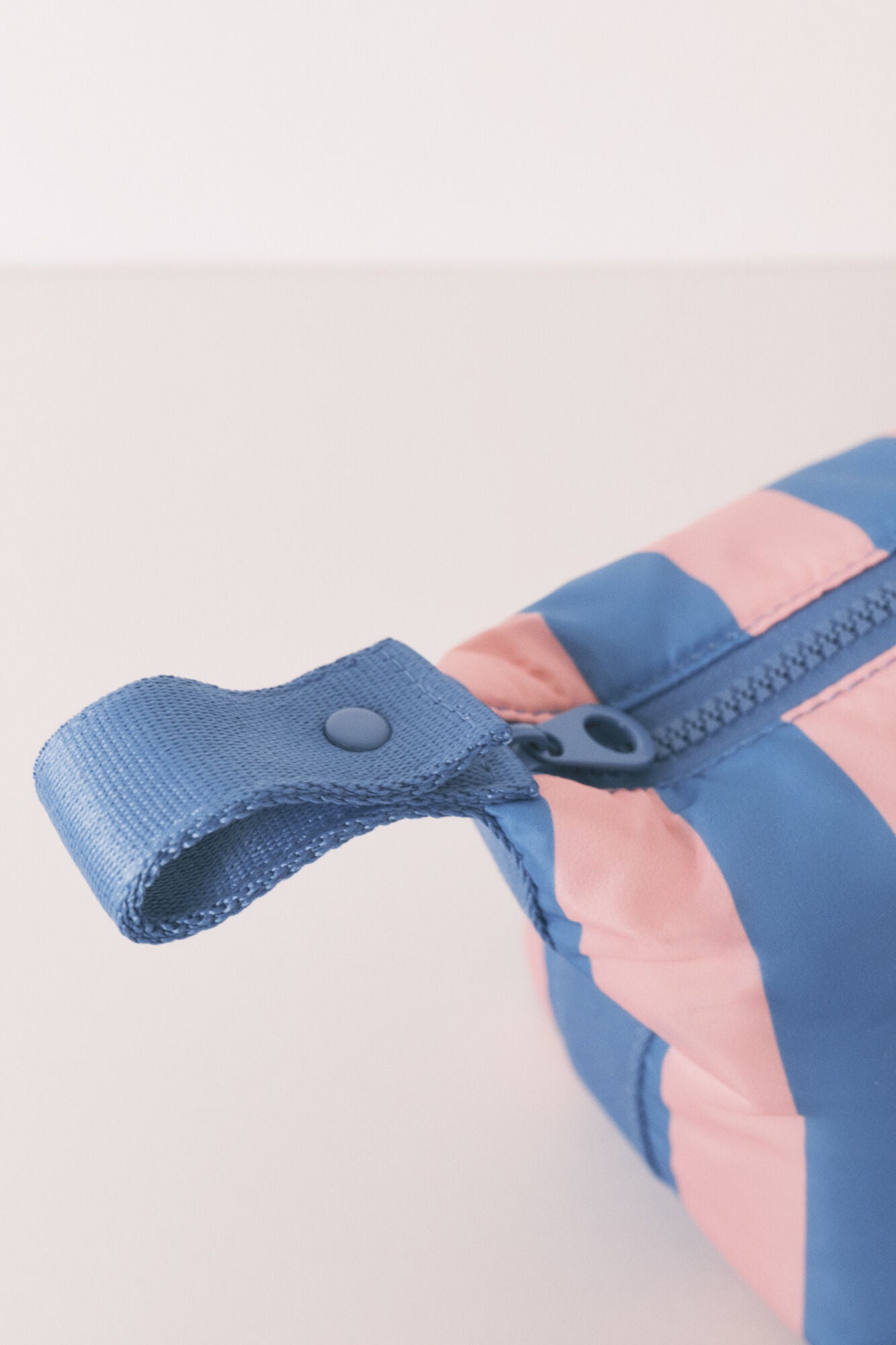 Medium-sized toiletry bag with blue striped print