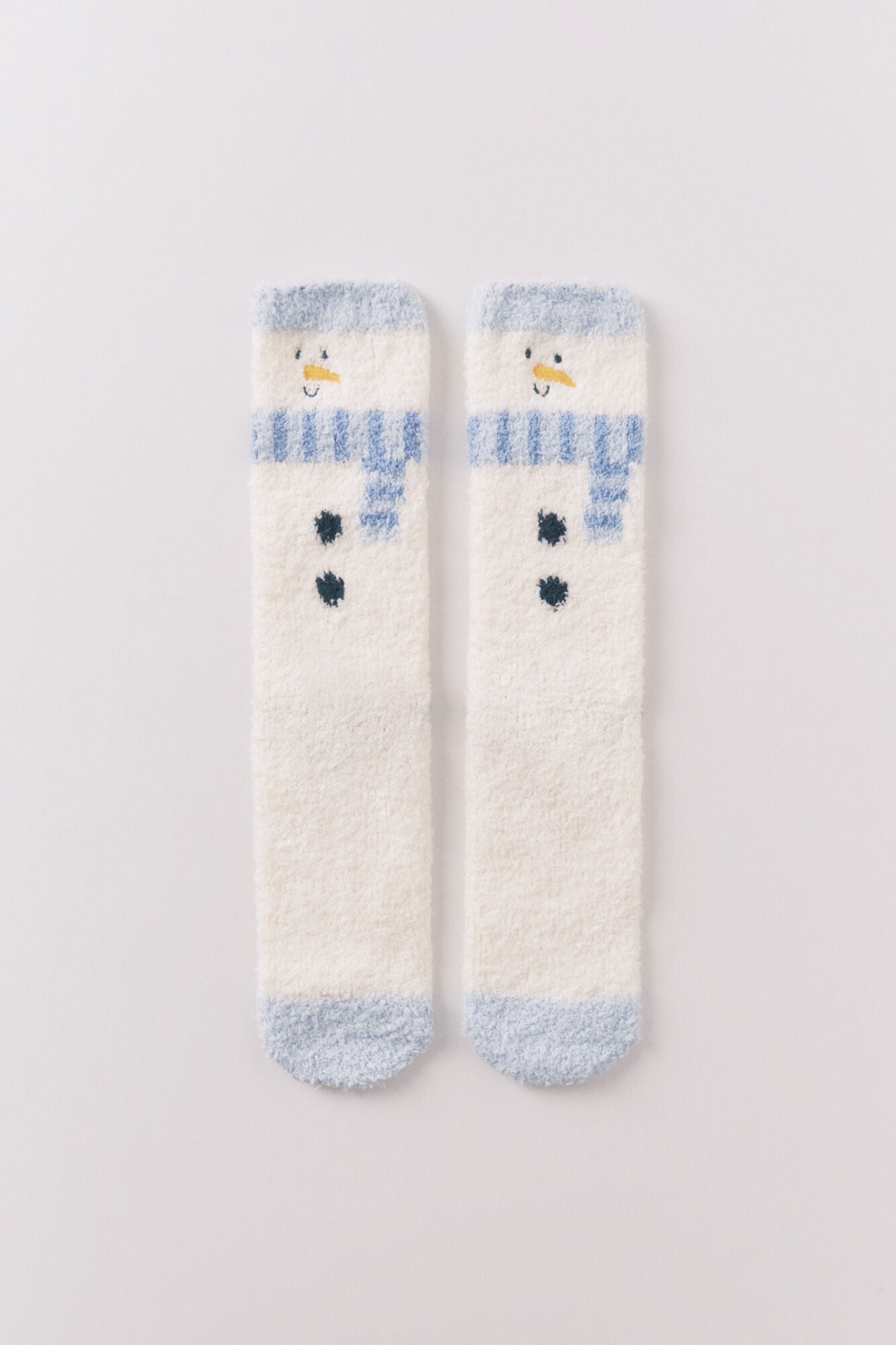 Long fur socks with snowman print.