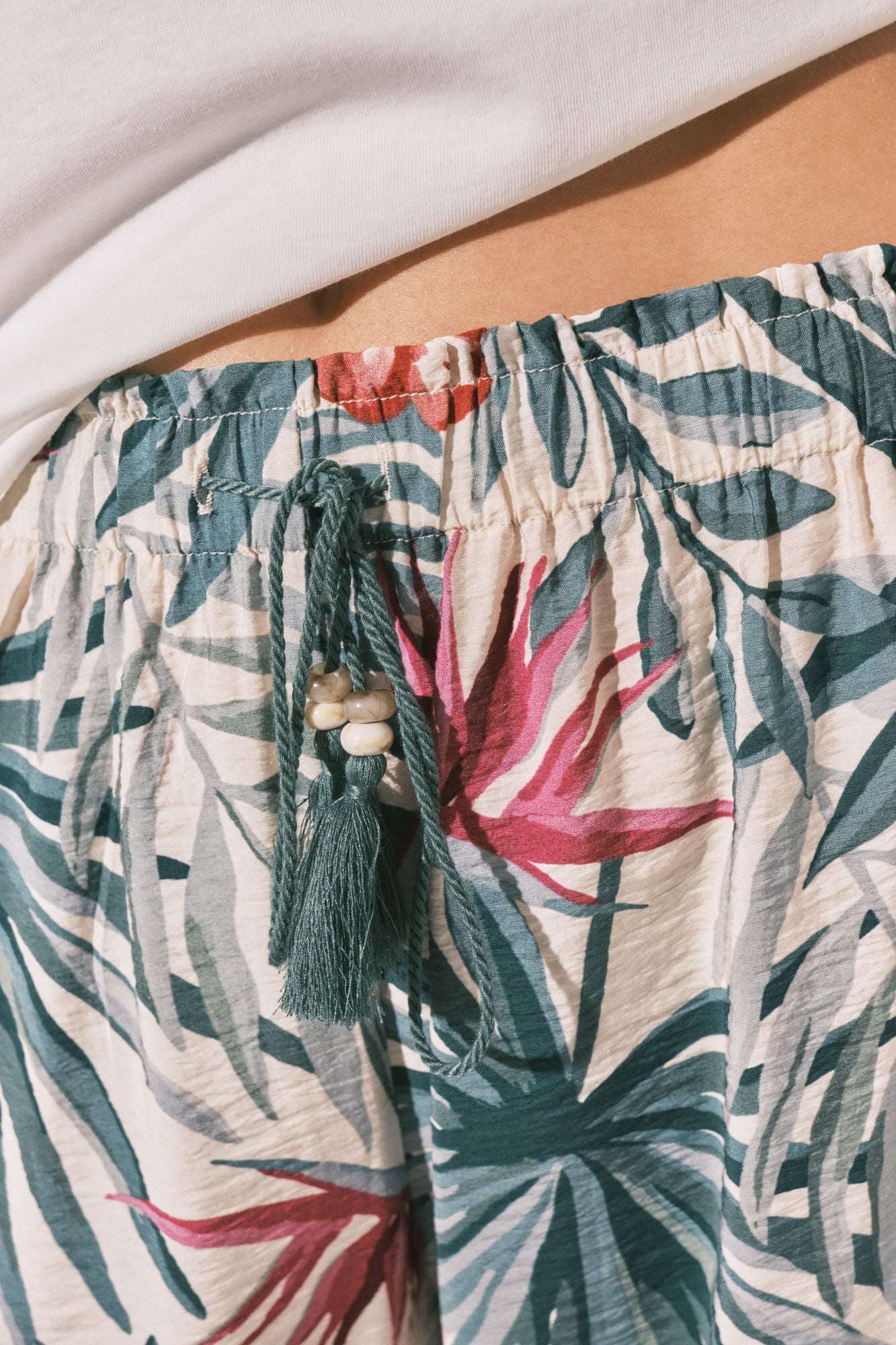 Long green patterned trousers