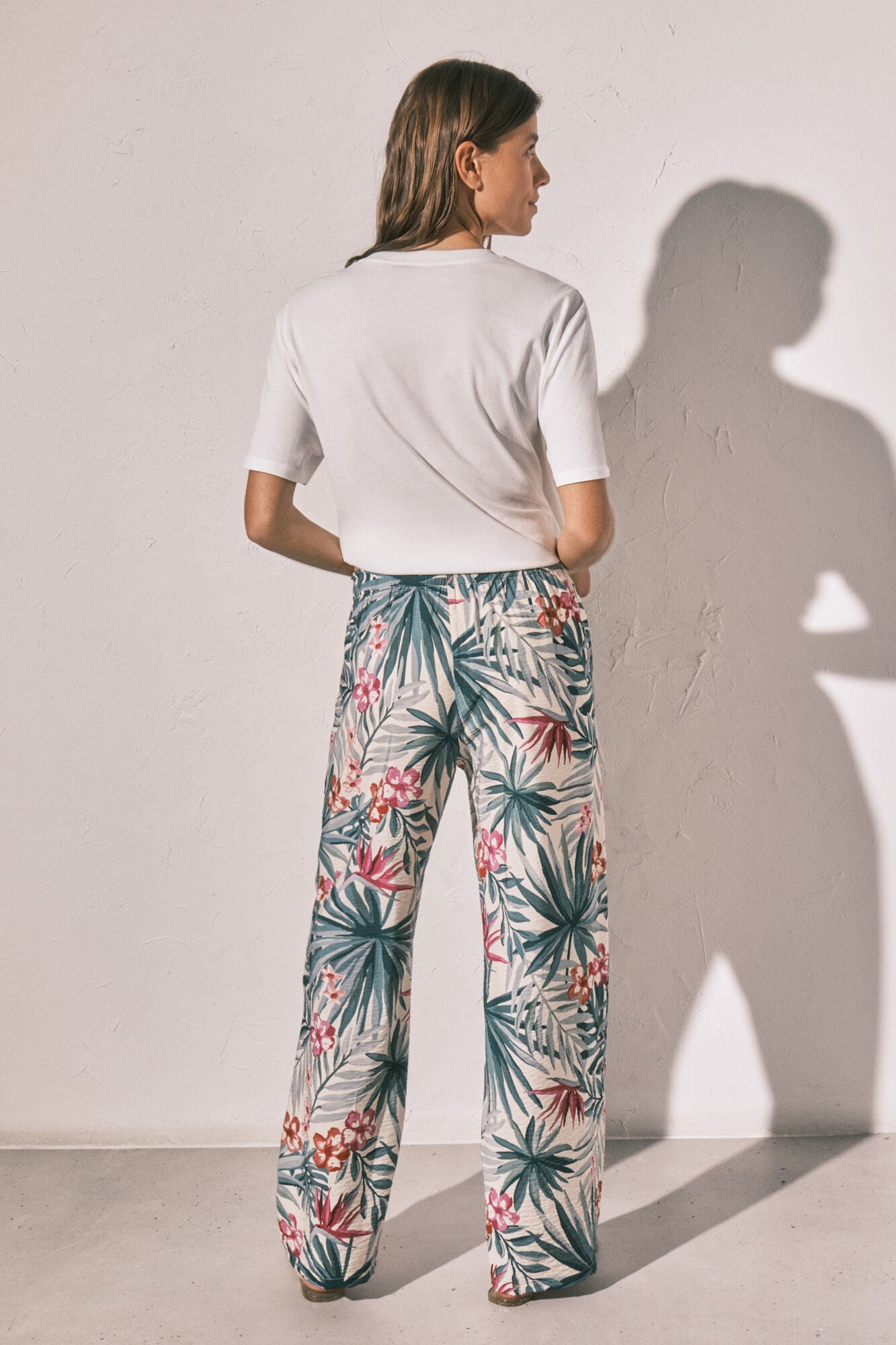 Long green patterned trousers