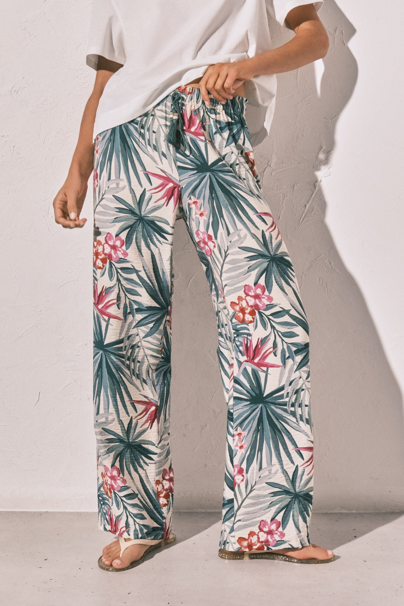 Long green patterned trousers