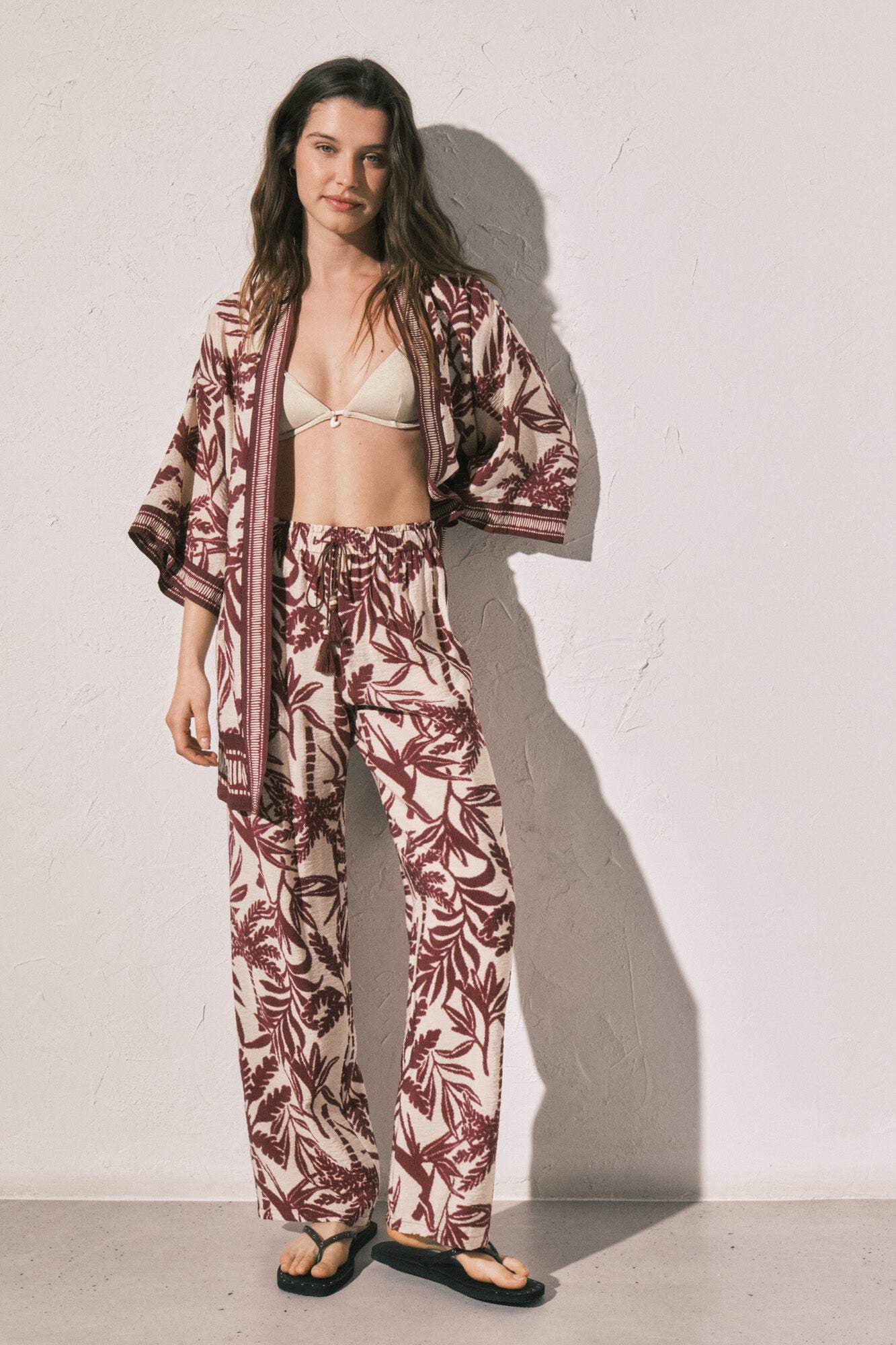 Burgundy patterned long trousers