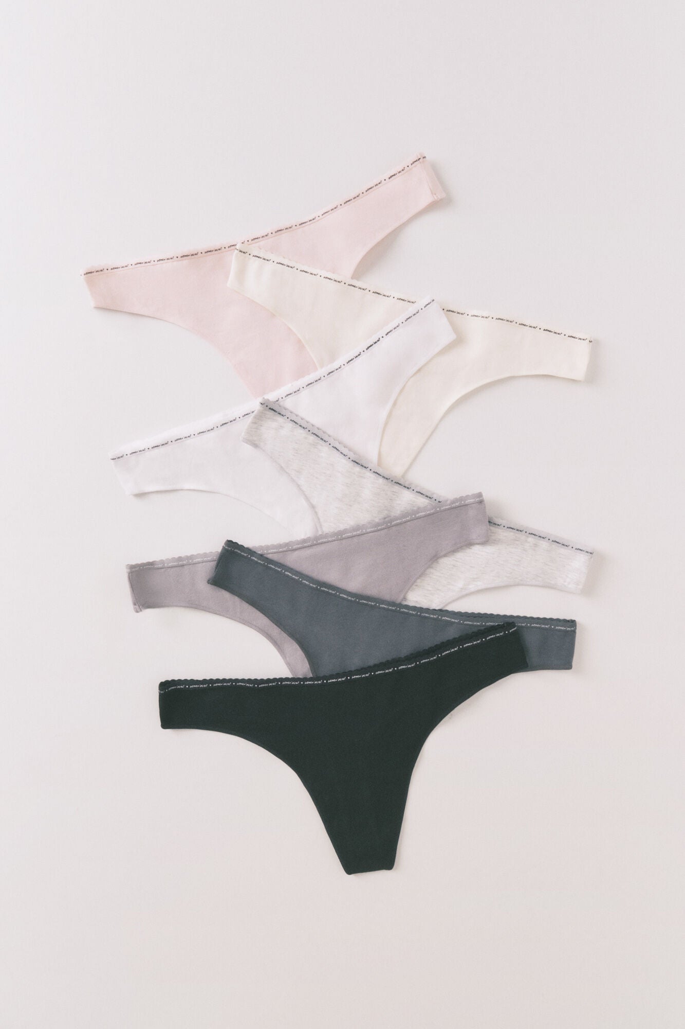 Pack of 7 neutral cotton thongs with logo