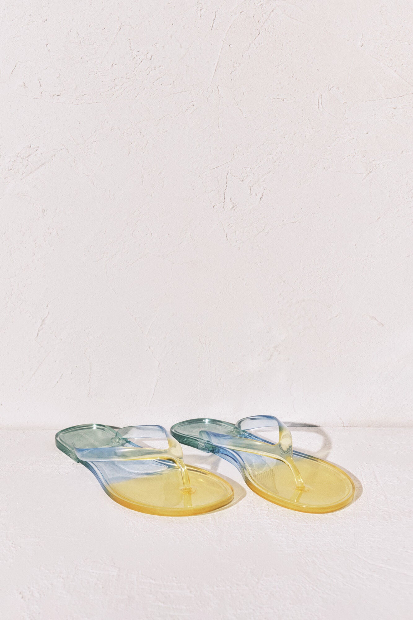 Transparent green flip-flops