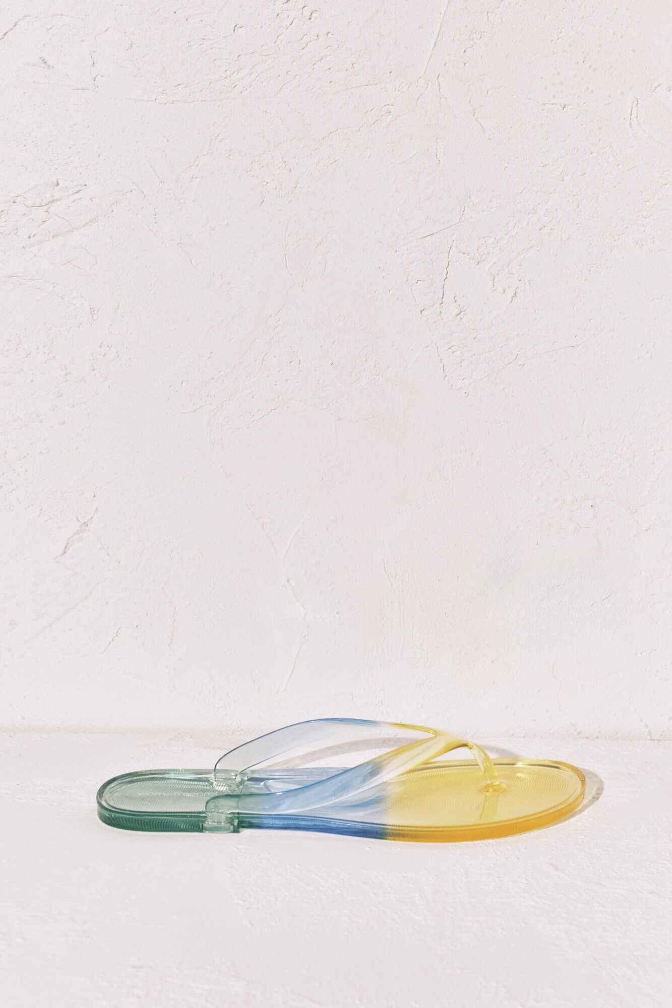 Transparent green flip-flops