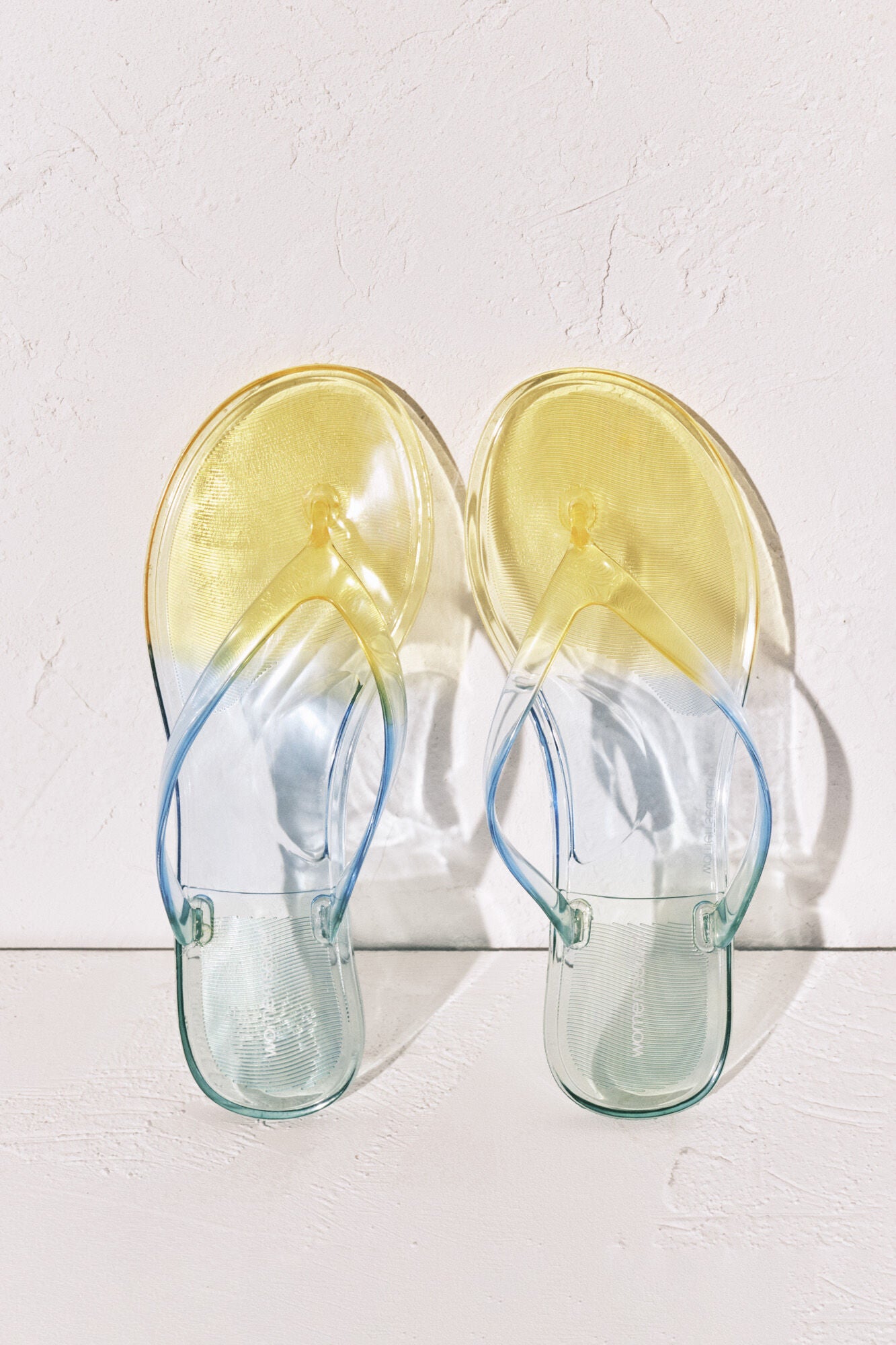 Transparent green flip-flops