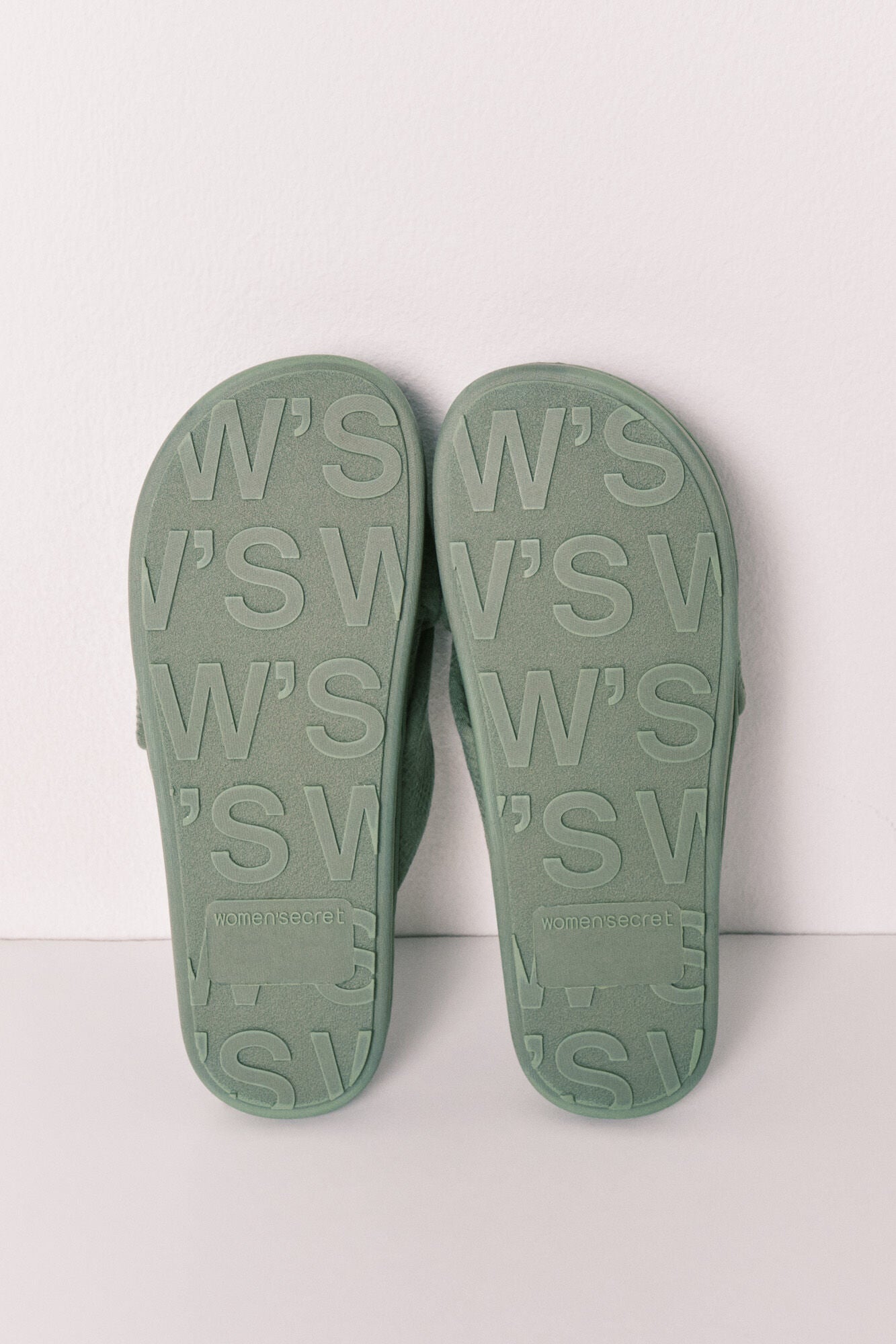 green knotted house slippers