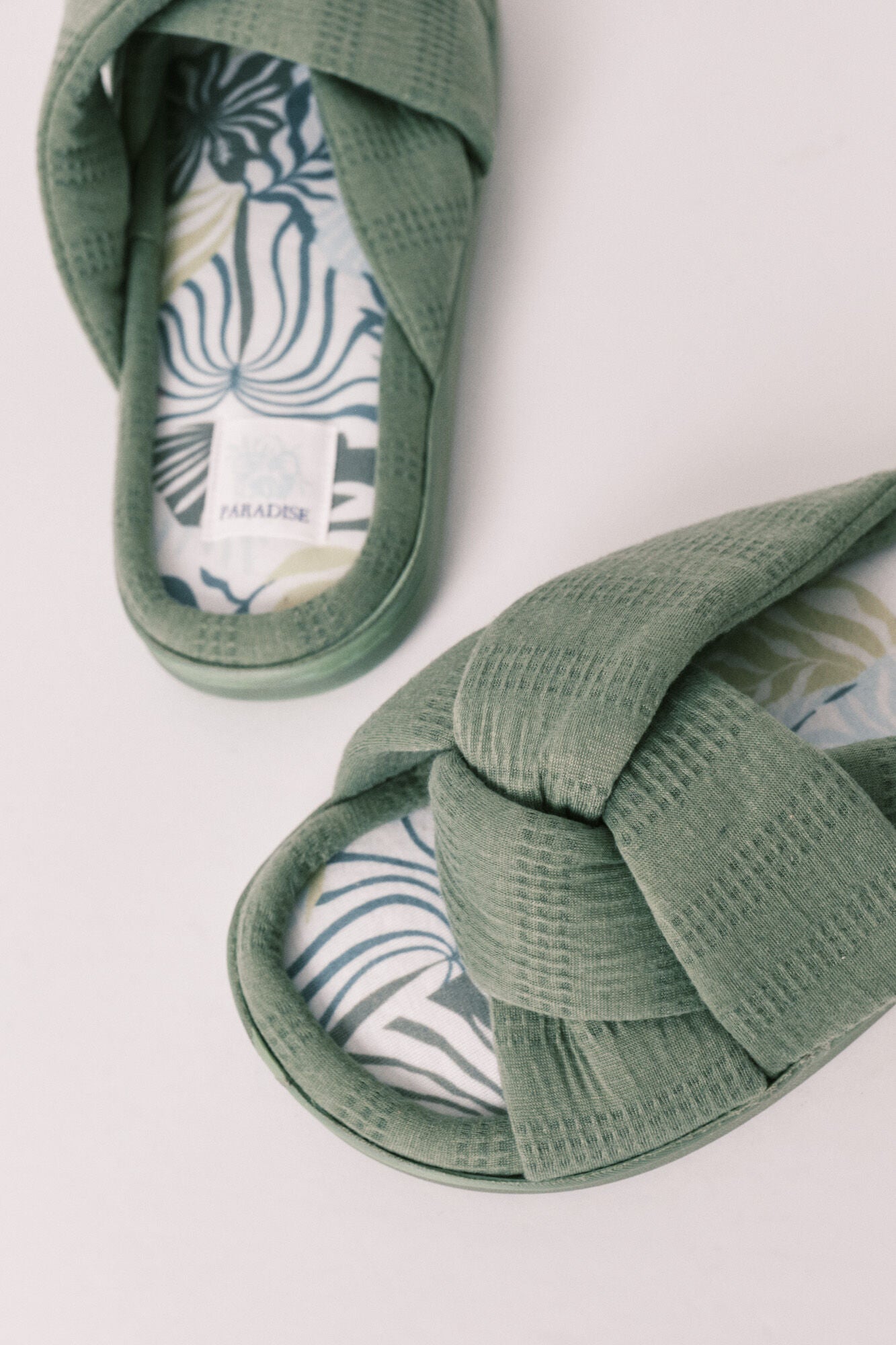 green knotted house slippers
