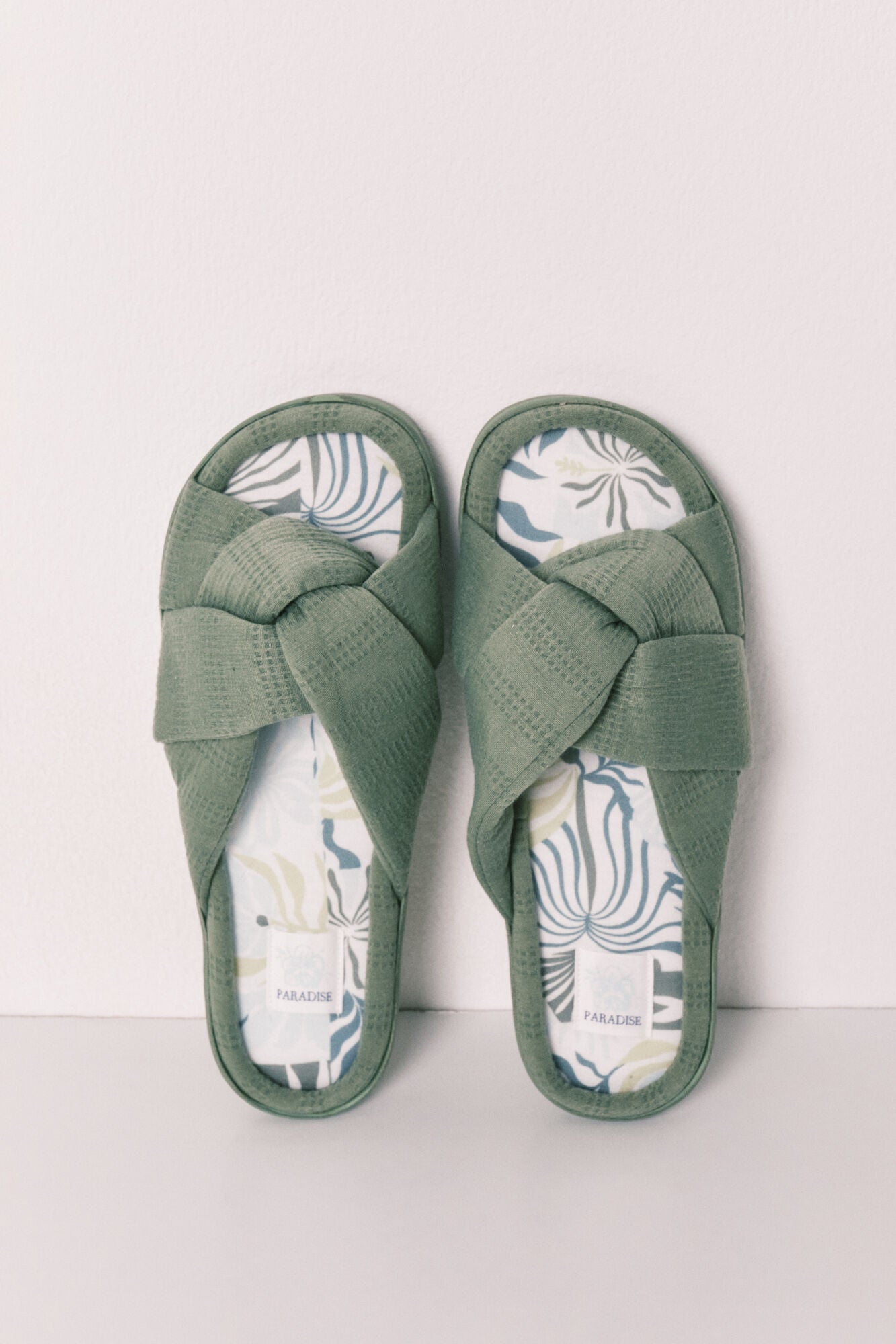 green knotted house slippers