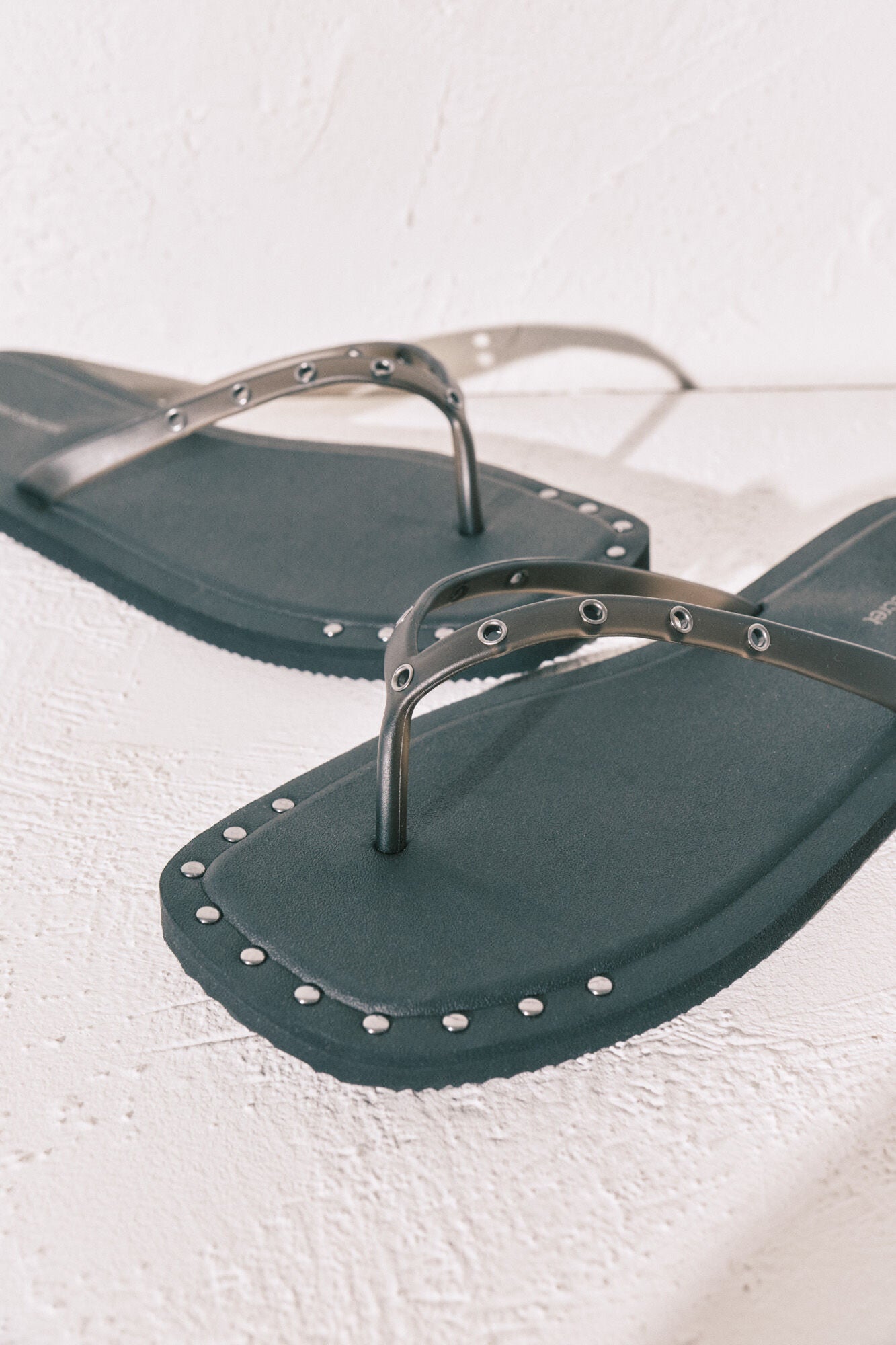 Black square-toe flip-flops with studs