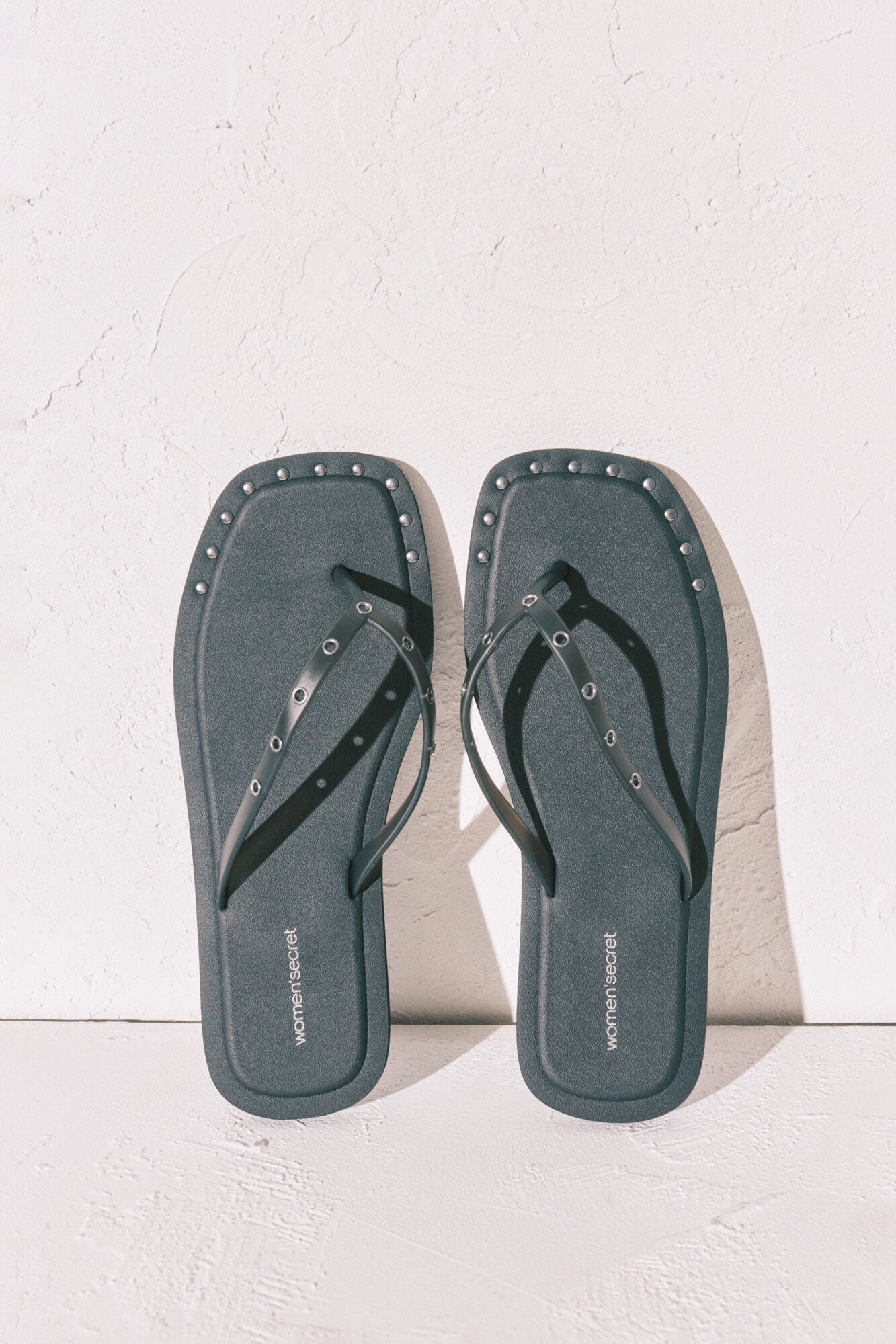 Black square-toe flip-flops with studs