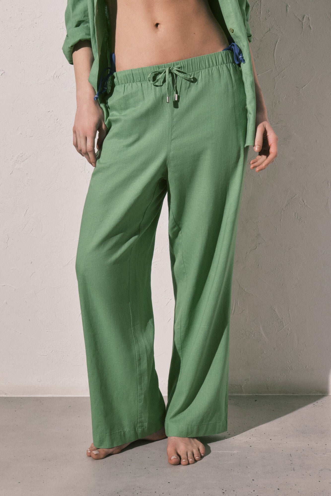Green linen trousers