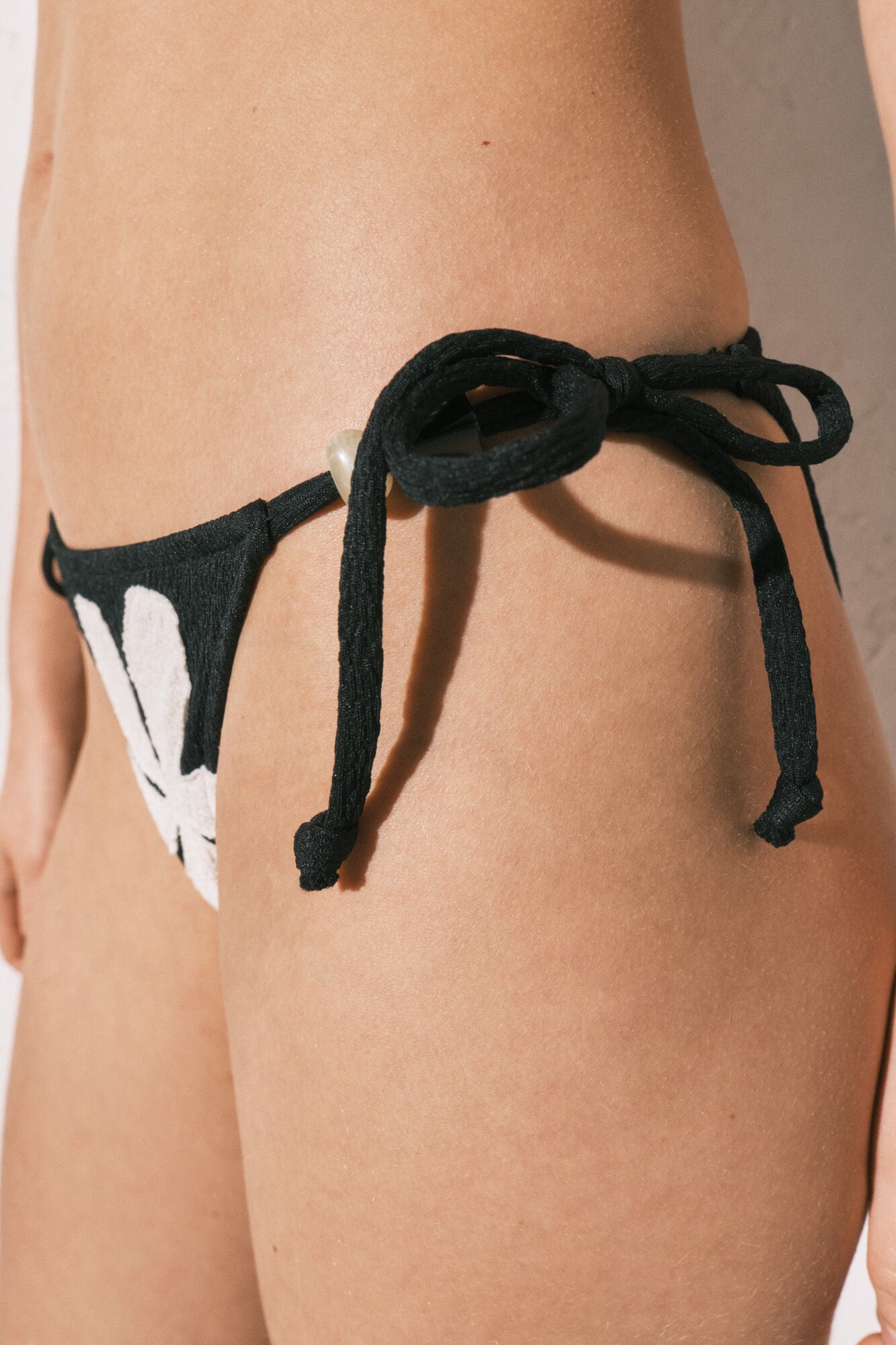 Floral print bikini briefs with straps