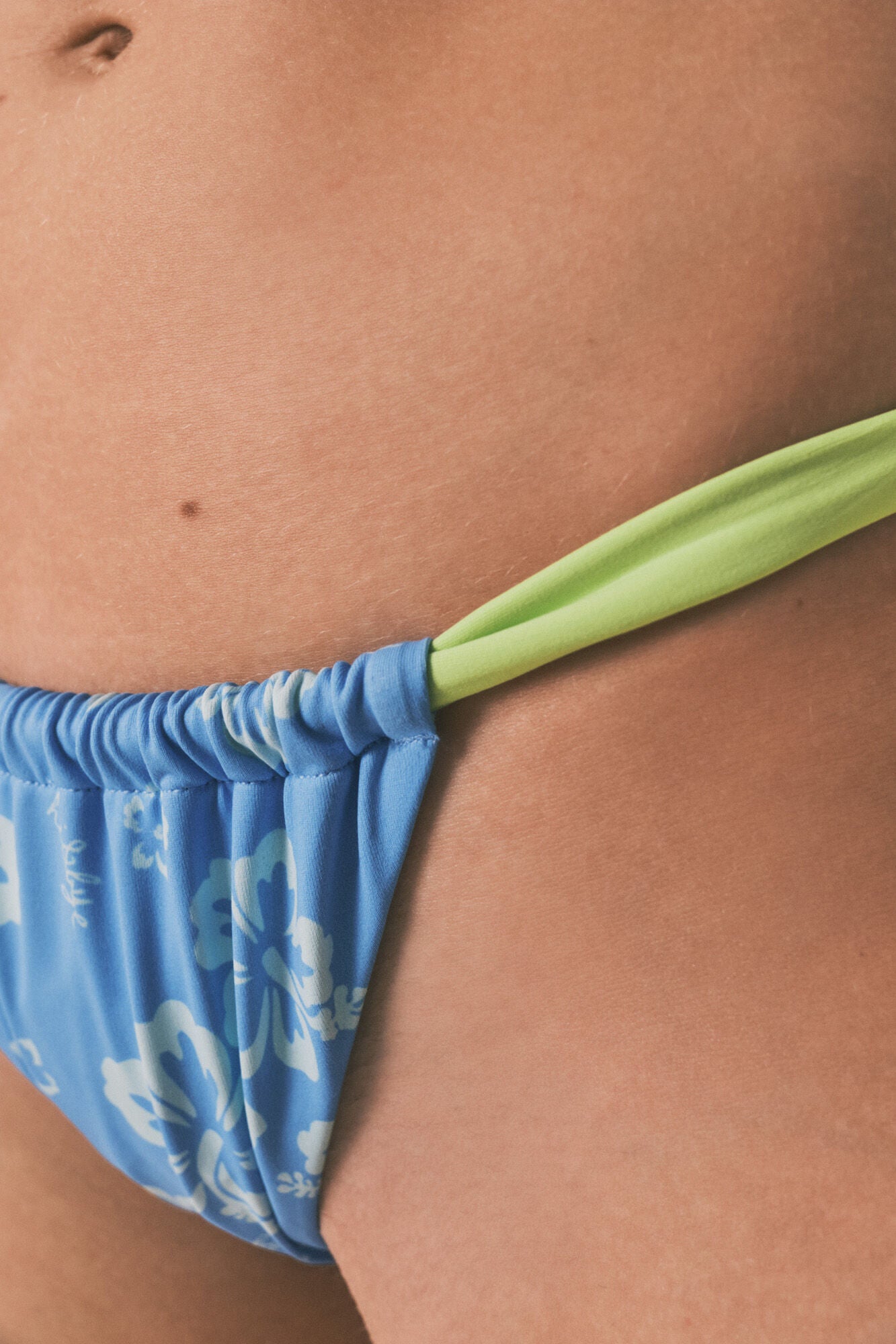 Blue tropical Brazilian bikini bottoms with straps